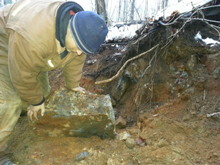 Graphite vein boulder found during build out of road to new drill hole location.