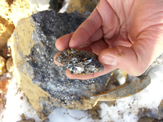 Graphite vein boulder found during build out of road to new drill hole location.